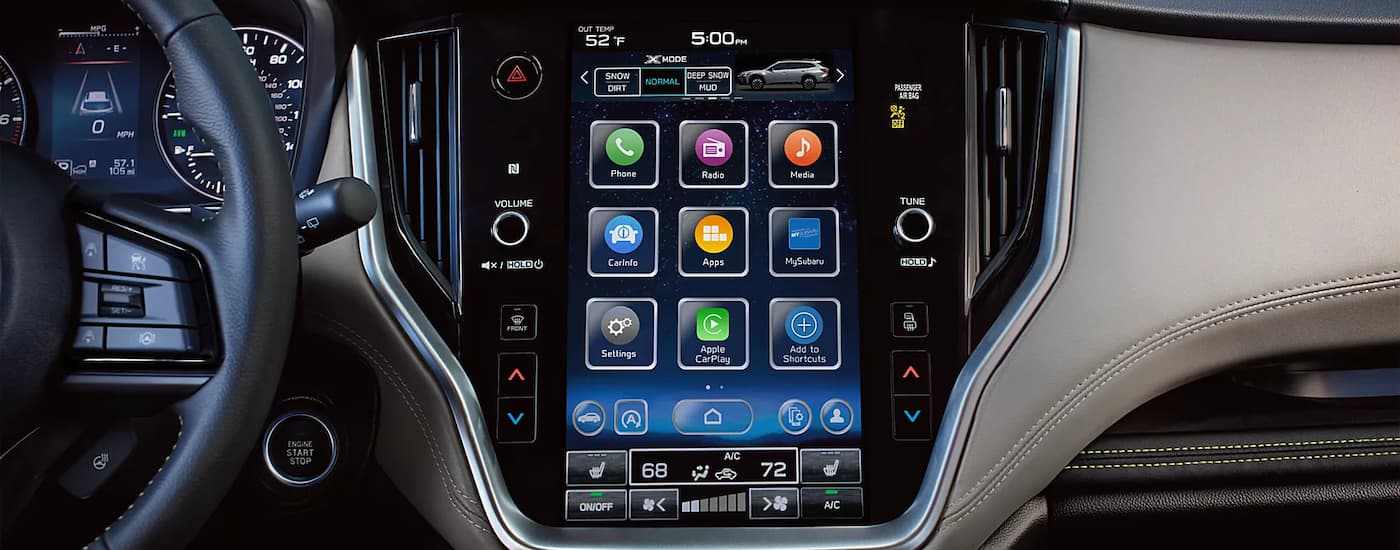 A closeup of the infotainment screen and digital dash in a 2023 Subaru Outback