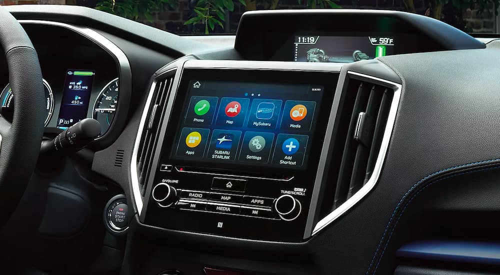 A close up shows the apps and infotainment screen in a 2023 Subaru Crosstrek Hybrid.