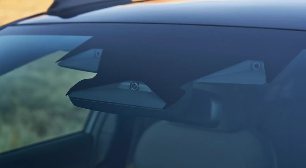 A close up shows the eye sight cameras in a 2024 Subaru Crosstrek.