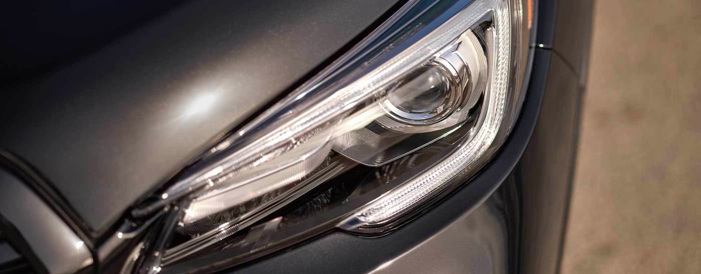 A close up shows the driver side headlight on a grey 2022 Subaru Ascent.