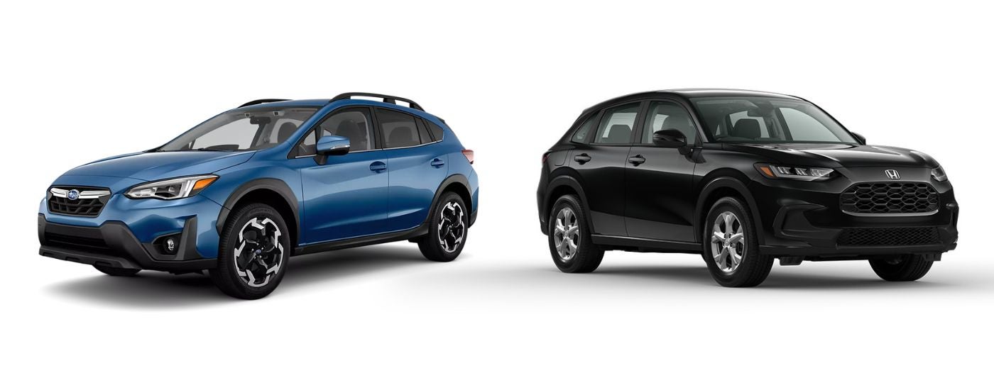 A blue 2023 Subaru Crosstrek and a black 2023 Honda HR-V angled away from each other on a white background