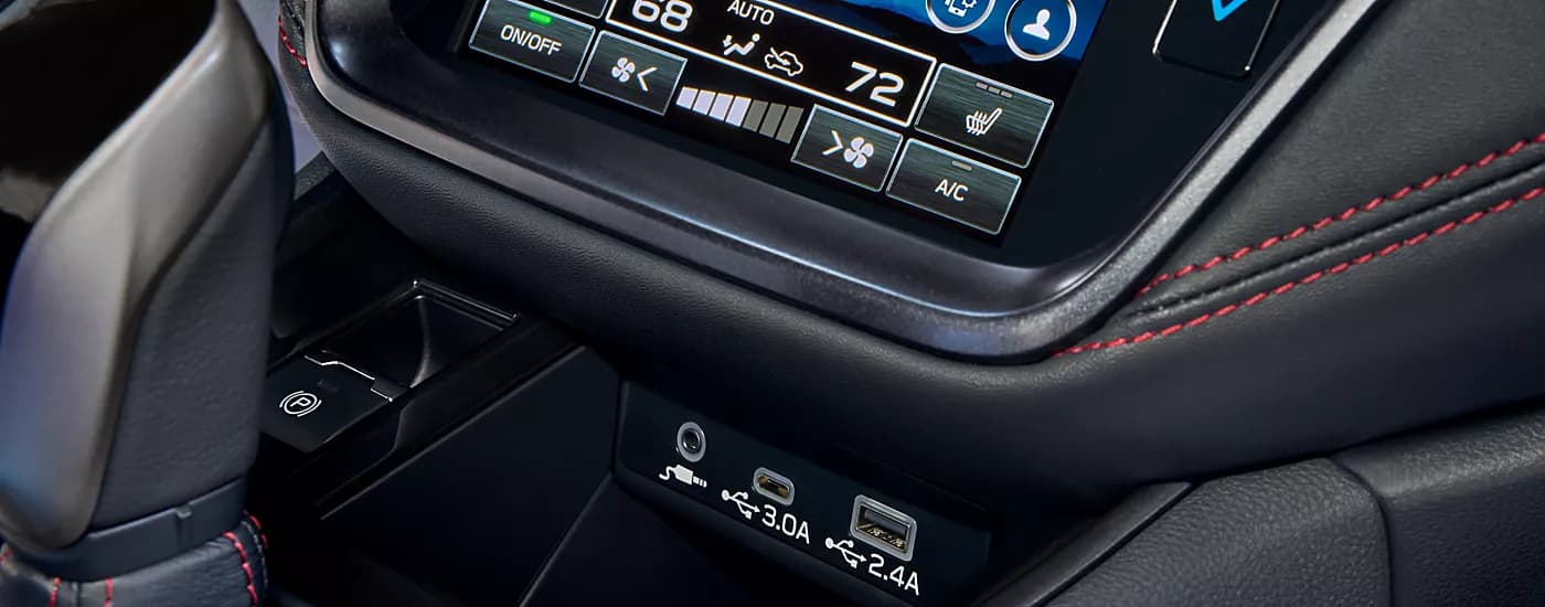Close-up of the USB ports and climate control options in a 2023 Subaru Legacy.