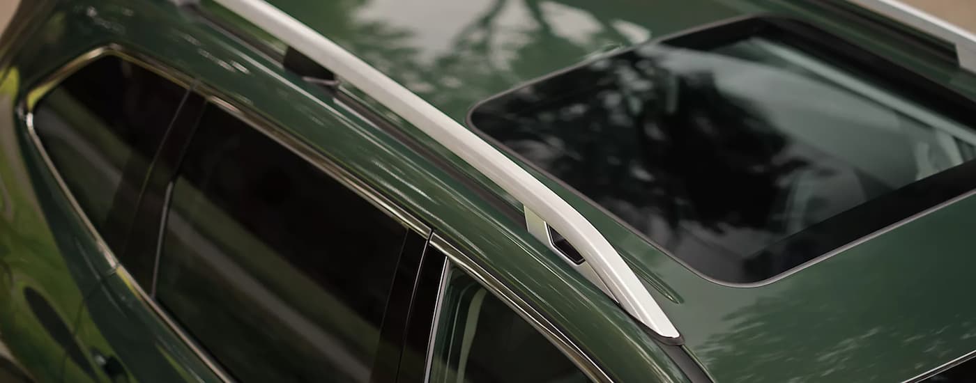 A close up of the roof rails on a green 2023 Subaru Forester is shown.