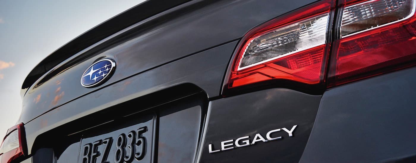 A close up shows the badging and taillight on a black 2017 Subaru Legacy.