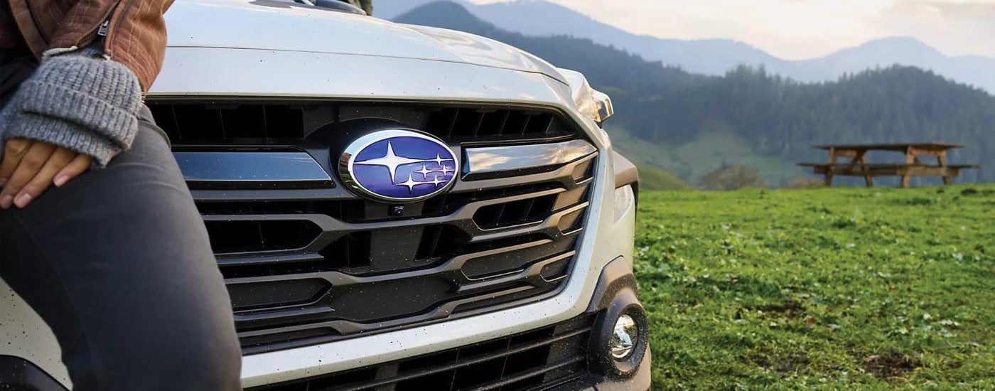 A close up shows the grille on a white 2024 Subaru Outback.