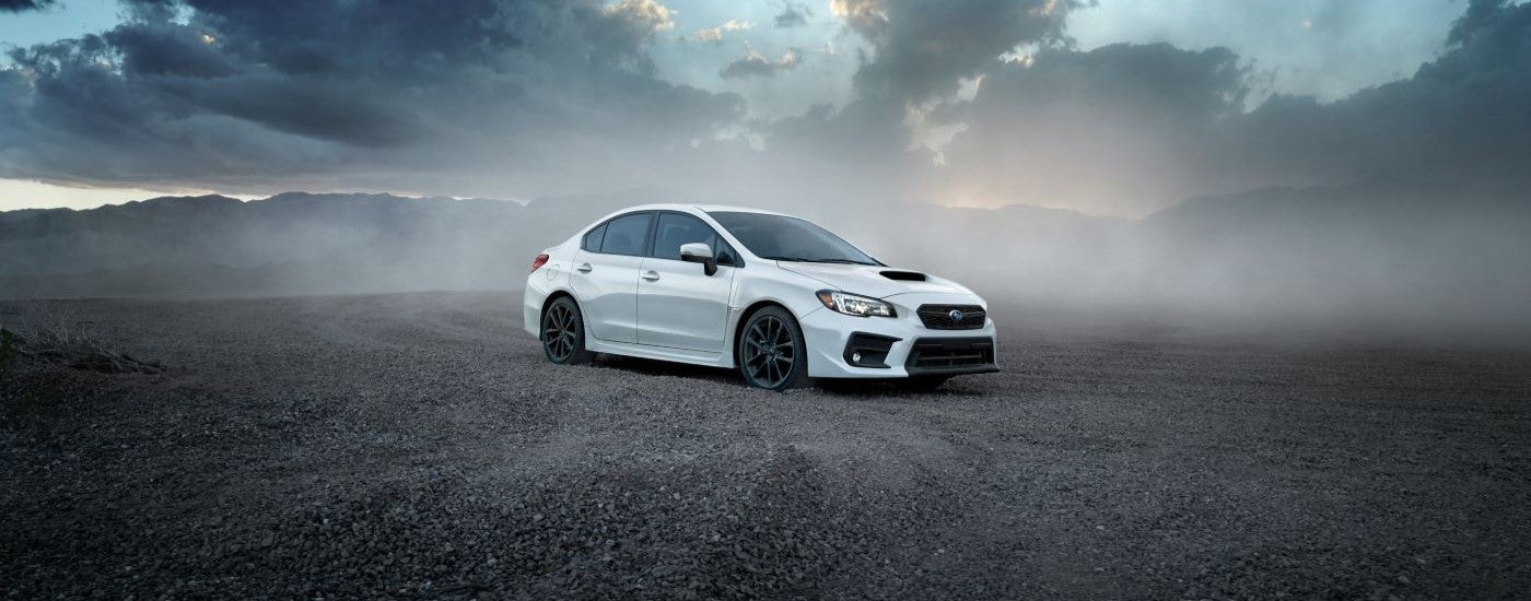 A white 2019 Subaru WRX is shown on a cloudy day after looking at used cars in Charlotte, NC.