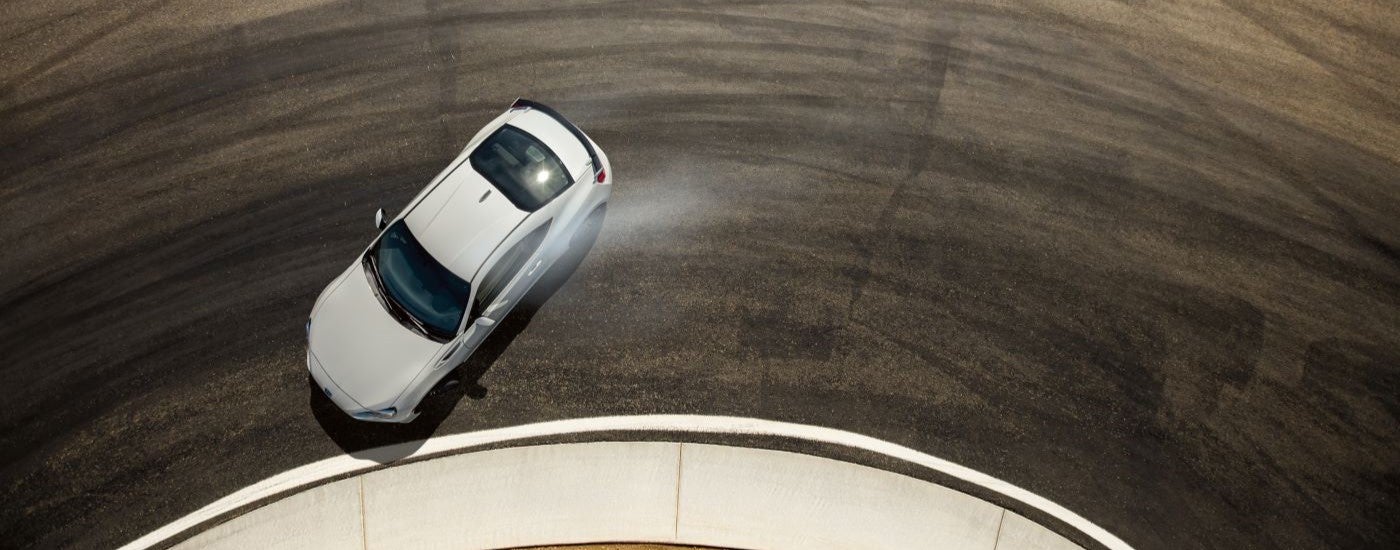 A white 2020 Subaru BRZ tS is shown from a high angle drifting on a race track.